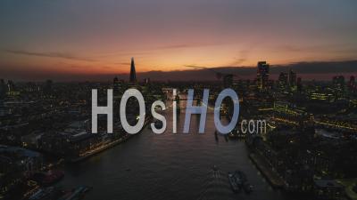 Establishing Aerial View Shot Of London Uk, United Kingdom, Colorful Sunset Over Tower Bridge - Video Drone Footage