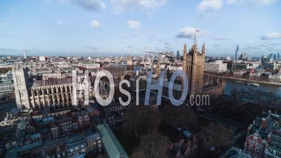 British Parliament, Westminster Abbey, Big Ben, London Eye, City Of London, Establishing Aerial View Shot Of London Uk, United Kingdom, Day - Video Drone Footage
