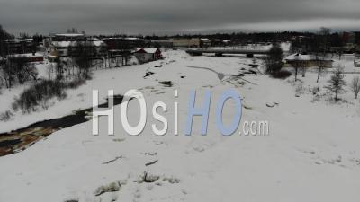 Icy River In A Rural Town - Video Drone Footage