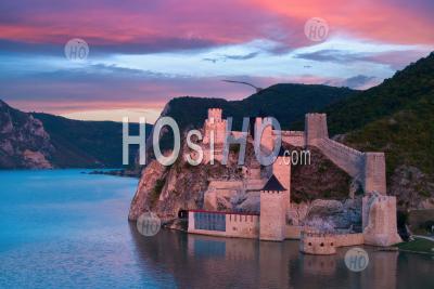 Medieval Fortress Golubac Illuminated By Pink Light. - Aerial Photography