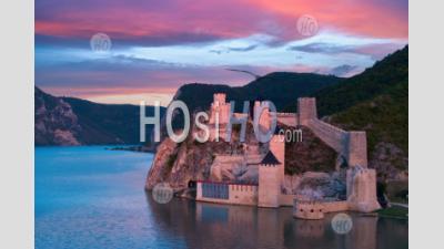 Medieval Fortress Golubac Illuminated By Pink Light. - Aerial Photography