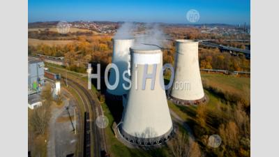 Cooling Towers Of A Thermal Power Plant With Steam On Top - Aerial Photography
