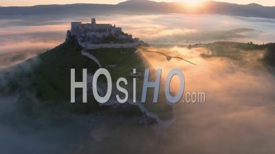 Flying Over Unesco Spis Castle, Lit By Morning Sun - Video Drone Footage