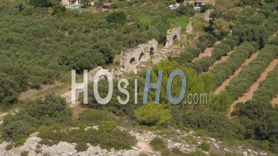Remains Of The Roman Aqueduct Of Barbegal In Fontvieille, Alpilles Regional Natural Park, Surrounded By Olive Trees, Bouches-Du-Rhone, France - Video Drone Footage