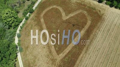 Heart Drawing In A Field Of Poppies, Mane, Luberon Regional Nature Park, Alpes-De-Haute-Provence, France - Video Drone Footage