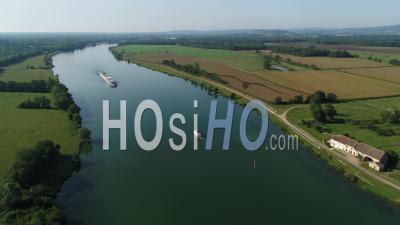 Cruise Boats On The River Saone Towards Chalon-Sur-Saone, Saone-Et-Loire, Burgundy-Franche-Comte, France - Video Drone Footage