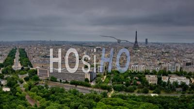Hyperlapse Showing The Eiffel Tower, Trafic On Outlying Street And Sky, Aerial Footage From Drone