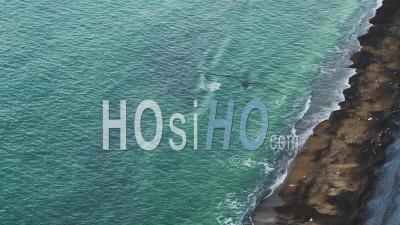 Aerial Drone Of Turquoise Blue Ocean Waves Breaking On Sandy Beach, Top Down View Of Patterns And Beauty In Nature On The Coast, Background With Copy Space