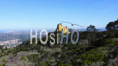 Aerial Drone View Of Pena Palace, Sintra, Lisbon, Portugal, And The Beautiful Forest And Mountain Landscape, Unesco World Heritage Site Architecture And Popular Tourist Attraction, Europe