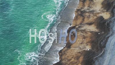 Aerial Drone Of Turquoise Blue Ocean Waves Breaking On Sandy Beach, Top Down View Of Patterns And Beauty In Nature On The Coast, Background With Copy Space
