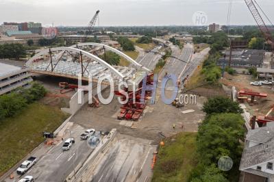 Bridge Rolls Into Place Across Detroit Highway - Aerial Photography
