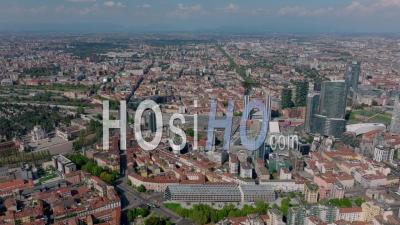 Aerial Slide And Pan Footage Of Milano Porta Garibaldi Railway Station And Surrounding Modern High Rise Buildings. Milano, Italy. - Video Drone Footage