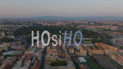 Aerial Slide And Pan Footage Of Tiburtino Urban Borough With Large Cemetery. Panoramic View Of City At Dusk. Rome, Italy - Video Drone Footage