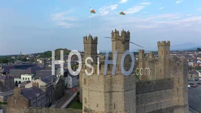 Caernarfon Castle, Caernarfon, Gwynedd, Wales, United Kingdom - Video Drone Footage