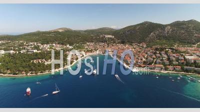 An Aerial View Shows Boats Approaching The Port Of Hvar, Croatia - Video Drone Footage
