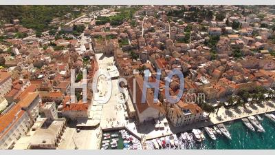 An Aerial View Shows Boats Docked In The Port Town Of Hvar, Croatia - Video Drone Footage