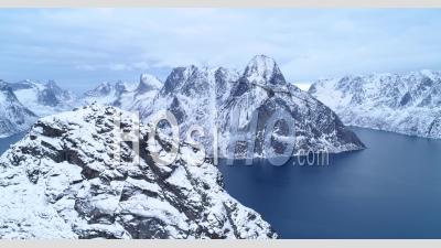 Snow-Covered Mountains Are Seen In The Lofoten Islands, Norway - Video Drone Footage
