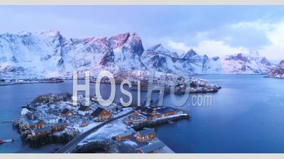 Snow-Covered Mountains Are Seen At Sunset In The Lofoten Islands, Norway - Video Drone Footage