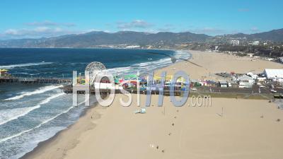 2022 - Excellent Aerial View Of Amusement Park Rides At Santa Monica Pier - Video Drone Footage