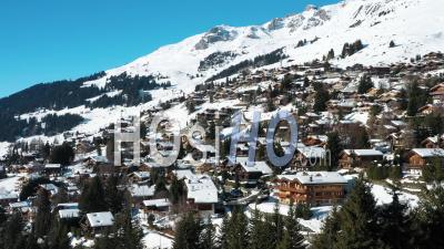 2022 - Excellent Aerial View Of The Wintry Mountain Town Of Verbier, Switzerland - Video Drone Footage