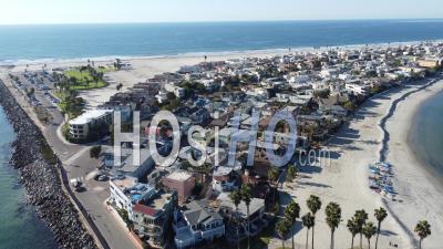 Nice Aerial Over Seaside Condos, And Vacation Homes Along South Mission Beach, San Diego, California - Video Drone Footage