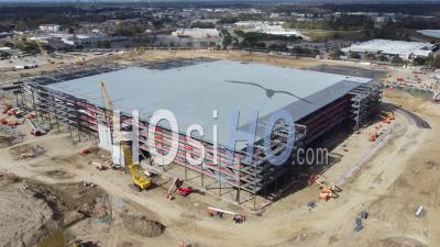 2022 - Aerial Over A Large Amazon Robotics Fulfillment Center Under Construction In Baton Rouge, Louisiana - Video Drone Footage