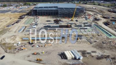 2022 - Aerial Over A Large Amazon Robotics Fulfillment Center Under Construction In Baton Rouge, Louisiana - Video Drone Footage