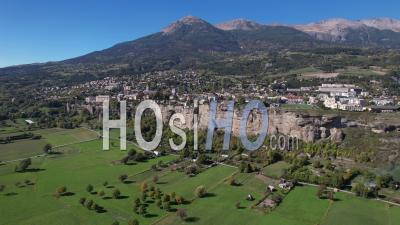 The Town Of Embrun Sur Son Roc, Hautes-Alpes, France, Viewed From Drone