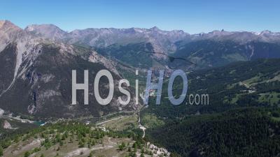 Narrow Valley And Bardonecchia Town At The Entrance To The Frejus Alpine Tunnel, Piemont, Italy, Viewed From Drone