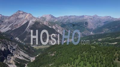 Narrow Valley And Bardonecchia Town At The Entrance To The Frejus Alpine Tunnel, Piemont, Italy, Viewed From Drone