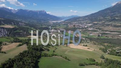 Durance Valley Near The Town Of Embrun, Hautes-Alpes, France, Viewed From Drone