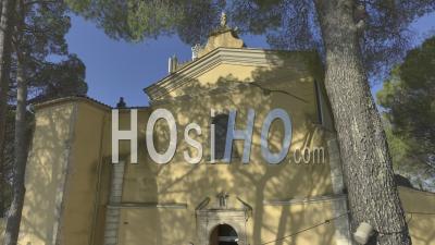 Notre-Dame-Des-Graces Church In Cotignac Village, Provence, France - Video Drone Footage