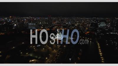 Osaka Castle At Night From A High Distance - Video Drone Footage