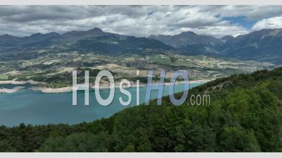 The Serre-Poncon Lake At Pontis Towards Sauze-Du-Lac, Hautes-Alpes, France - Video Drone Footage