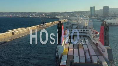 Marseille, Euromediterranean Area, Seawall, Arrival Of A Cargo Ship Corsica Ferry In The Large Maritime Port Of Marseille, Bouches-Du-Rhone, France - Video Drone Footage