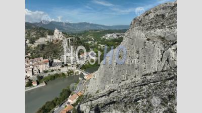 Sisteron On The Banks Of The Durance, A Stopover Town On The Route Napoleon And The Rocher De La Baume, Alpes-De-Haute-Provence, France - Aerial Photography