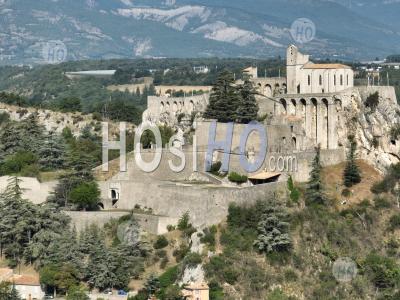 Sisteron On The Banks Of The Durance, A Stopover Town On The Route Napoleon And The Rocher De La Baume, Alpes-De-Haute-Provence, France - Aerial Photography
