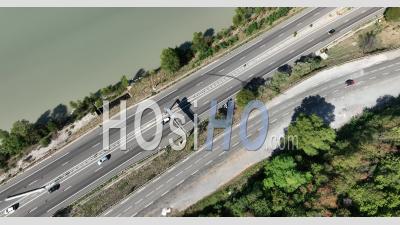 Top View Of The Motorway In Sisteron On The Banks Of The Durance, A Stopover Town On The Route Napoleon And The Rocher De La Baume, Alpes-De-Haute-Provence, France - Video Drone Footage