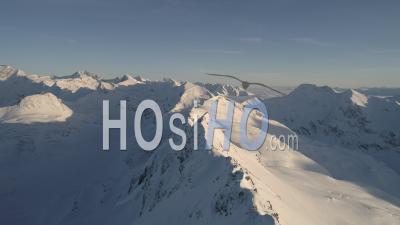 Aerial Footage Of Snow Covered Mountains In The Austrian Alps - Video Drone Footage