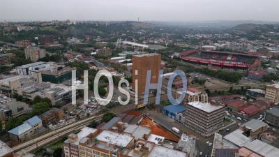 Looking East Over Ellis Park And Doornfontein In Johannesburg At Dusk In Summer - Video Drone Footage