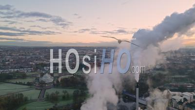 Strathclyde Distillery Chimneys On The River Clyde At Dawn In Winter With Glasgow Green And East End In The Background - Video Drone Footage