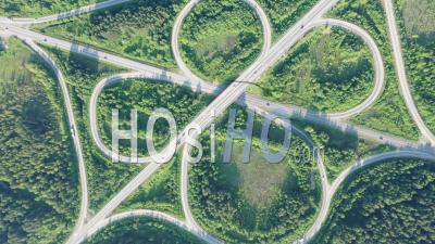 Aerial View Of Highway Interchange. Road Junction - Video Drone Footage