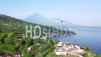 Aerial Shot Of A Bay With A View Of A Volcano In East Bali - Video Drone Footage