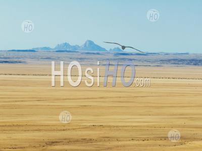 Desert Landscape With The Spitzkoppe Mountains In The Background, Khomas, Namibia - Aerial Photography