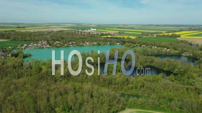 Colorful Lakes And Fields In Agricultural Plains In Spring, France, Drone Point Of View