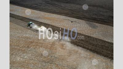 Dust Blows As Farmer Tills Field - Aerial Photography