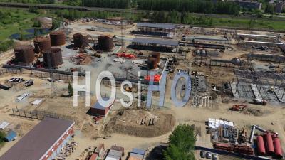 Construction Of A Tank For An Oil Storage Facility Using The Sheet-By-Sheet Assembly Method. Top View. Flying Around The Construction Site - Video Drone Footage