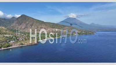 Sunrise Over Agung And Batur Volcanoes From Amed, Bali, Indonesia - Video Drone Footage