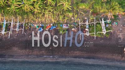Traditional Fishing Boats On Black Sand Beach In Amed, Bali, Indonesia - Video Drone Footage
