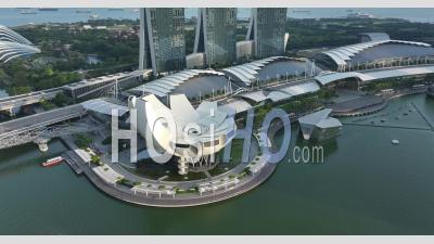  Marina Bay Sands Buildings And Artscience Museum At Sunset, Singapore - Video Drone Footage